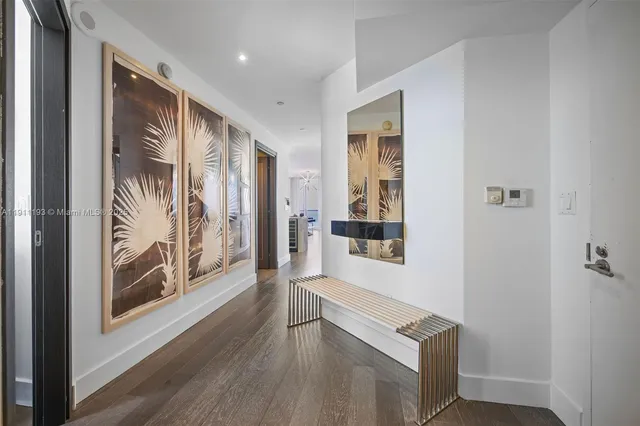 a bathroom with a sink vanity mirror and toilet