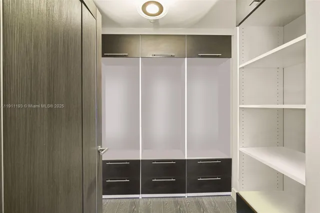 a bedroom with a bed and a two windows