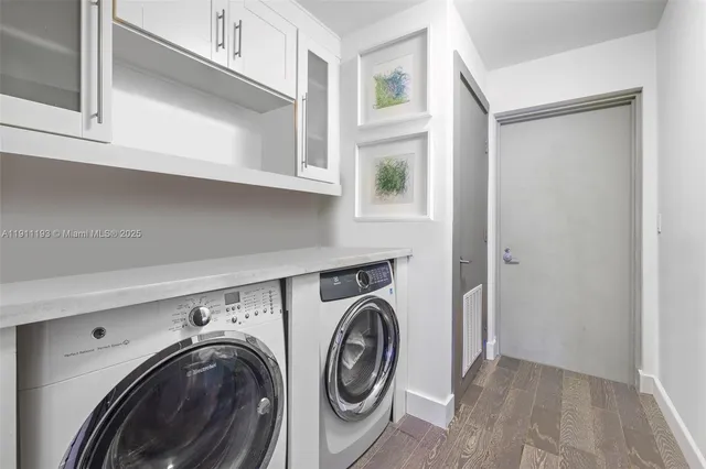 a view of an entryway with wooden floor