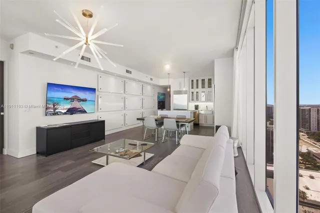 a kitchen with stainless steel appliances a stove a refrigerator and a sink