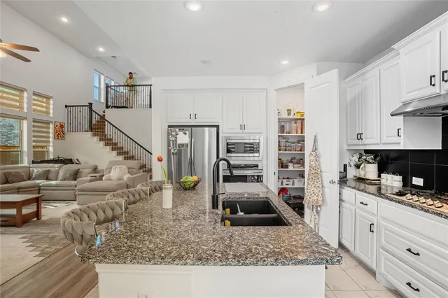 a view of living room with furniture and wooden floor