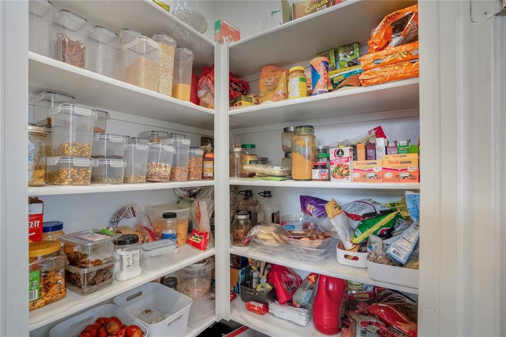 4424 English Maple Drive Arlington, TX 76005 - Photo 18 of 40 a store room with lots of clutter and storage