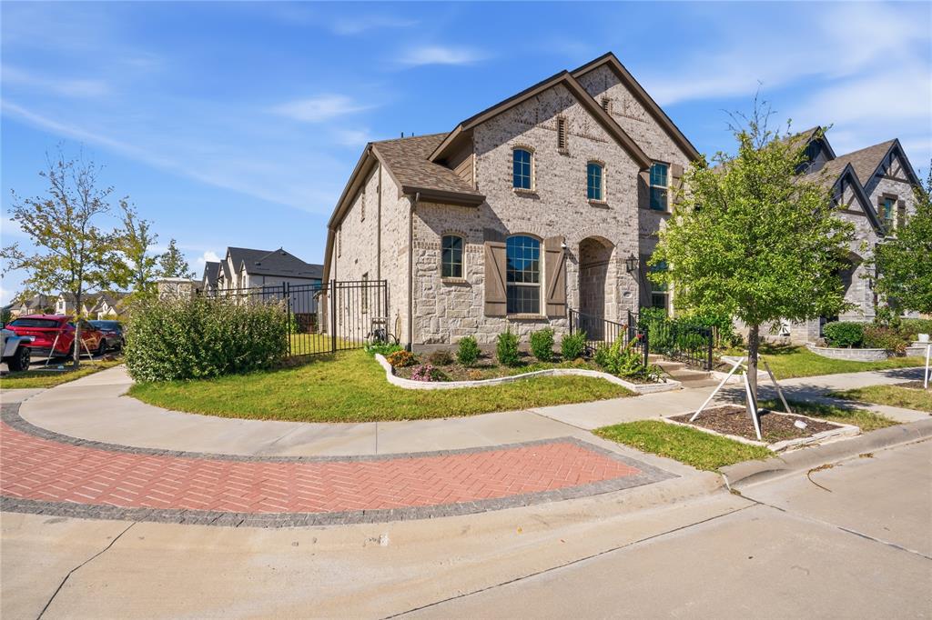 4424 English Maple Drive Arlington, TX 76005 - Photo 2 of 40 a front view of a house with a yard and garage