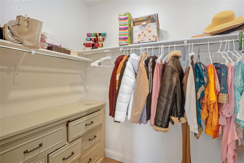 4424 English Maple Drive Arlington, TX 76005 - Photo 24 of 40 a view of walk in closet with clothes and shoes