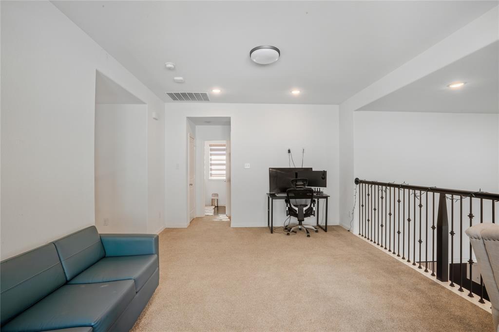 4424 English Maple Drive Arlington, TX 76005 - Photo 26 of 40 a living room with furniture and a dining table with wooden floor