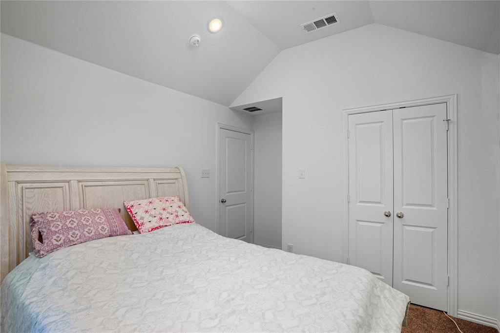 4424 English Maple Drive Arlington, TX 76005 - Photo 29 of 40 a bedroom with a bed and a table