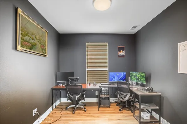 a work room with furniture and a window