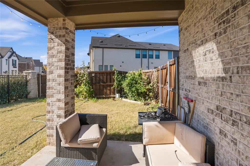 4424 English Maple Drive Arlington, TX 76005 - Photo 34 of 40 a view of balcony with furniture and a potted plant