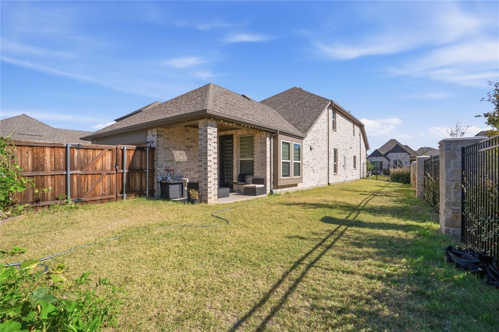 4424 English Maple Drive Arlington, TX 76005 - Photo 35 of 40 a view of a house with a yard