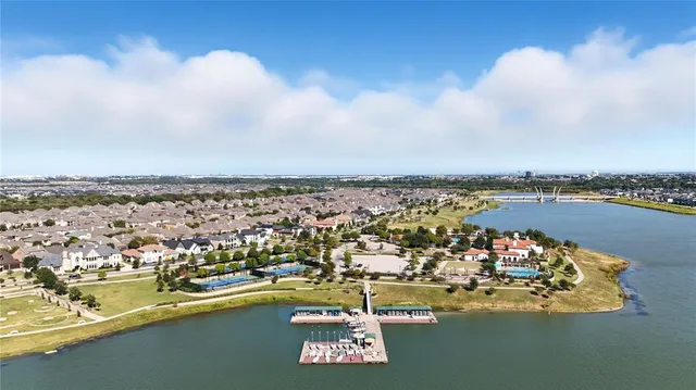 an aerial view of a city with lawn chairs