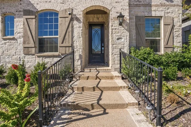 a view of front door of house and outdoor space