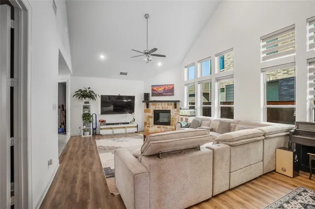 a living room with furniture and flat screen tv