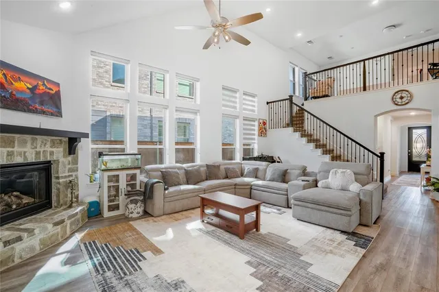 a living room with furniture and a fireplace
