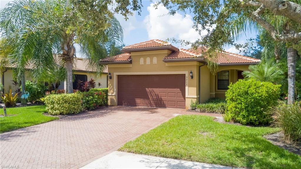 5211 Ciatto Way Ave Maria, FL 34142 - Photo 1 of 31 a front view of a house with a garden and plants
