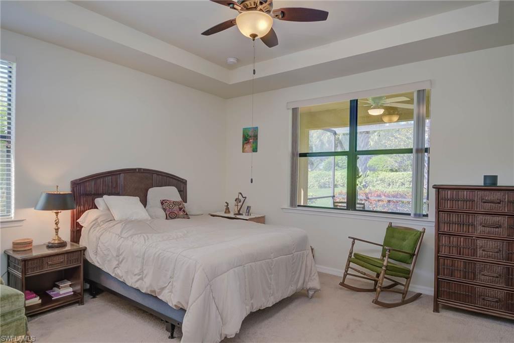 5211 Ciatto Way Ave Maria, FL 34142 - Photo 13 of 31 a bedroom with a bed a couch and a window