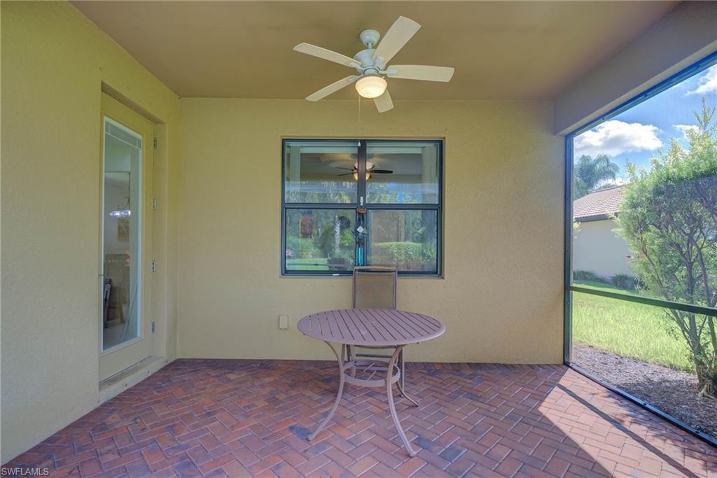 5211 Ciatto Way Ave Maria, FL 34142 - Photo 24 of 31 a view of a livingroom with a table and chair