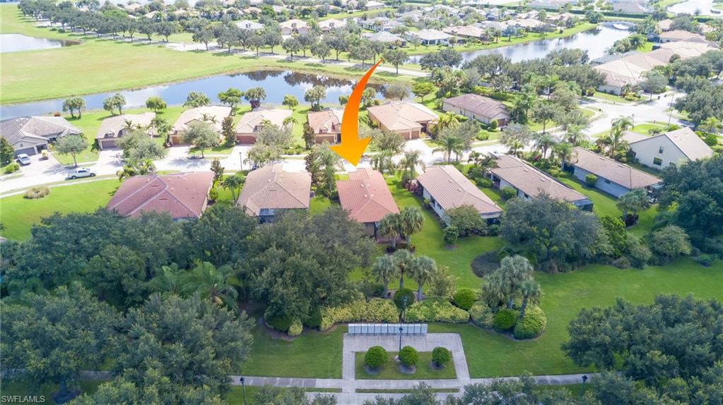 5211 Ciatto Way Ave Maria, FL 34142 - Photo 25 of 31 an aerial view of residential houses with outdoor space and trees all around