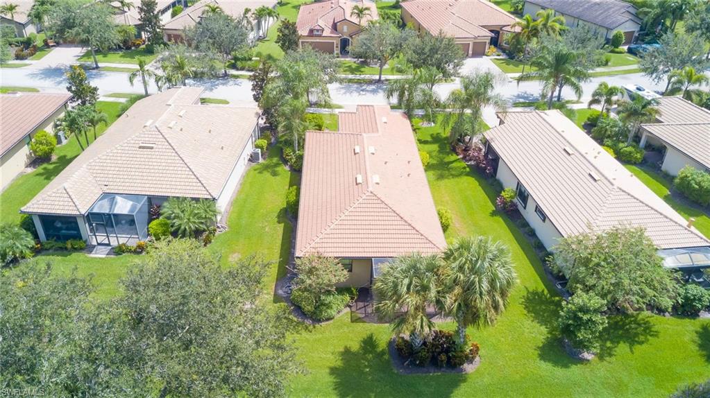 5211 Ciatto Way Ave Maria, FL 34142 - Photo 28 of 31 a aerial view of a house with a yard and potted plants