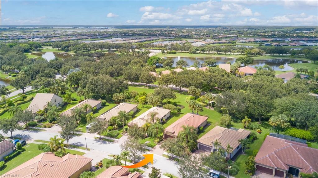 5211 Ciatto Way Ave Maria, FL 34142 - Photo 30 of 31 a view of a lake with houses