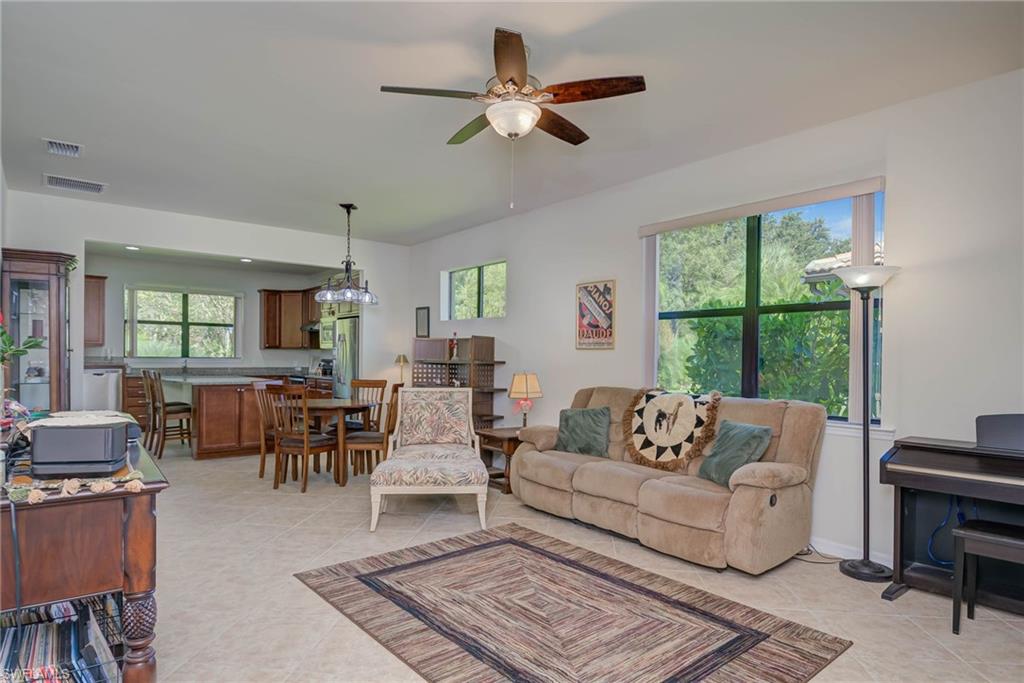 5211 Ciatto Way Ave Maria, FL 34142 - Photo 4 of 31 a living room with furniture a table and a large window