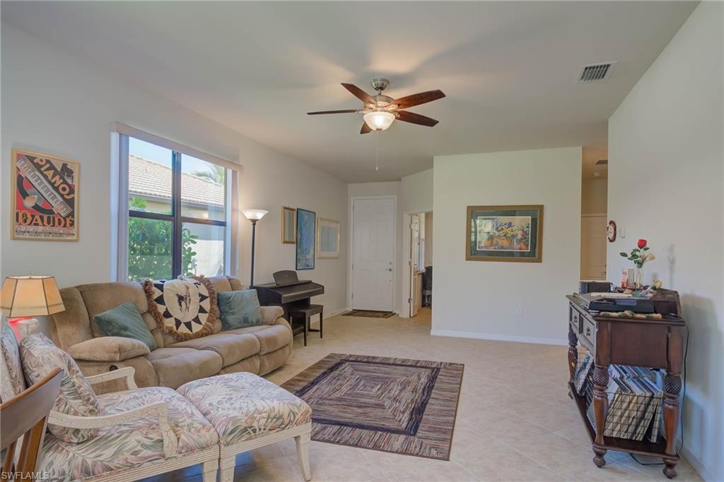 5211 Ciatto Way Ave Maria, FL 34142 - Photo 5 of 31 a living room with furniture and a window