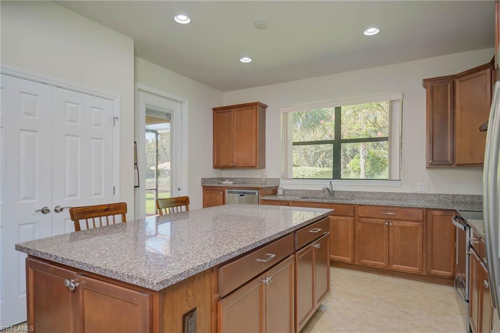 5211 Ciatto Way Ave Maria, FL 34142 - Photo 9 of 31 a kitchen with a sink window and cabinets