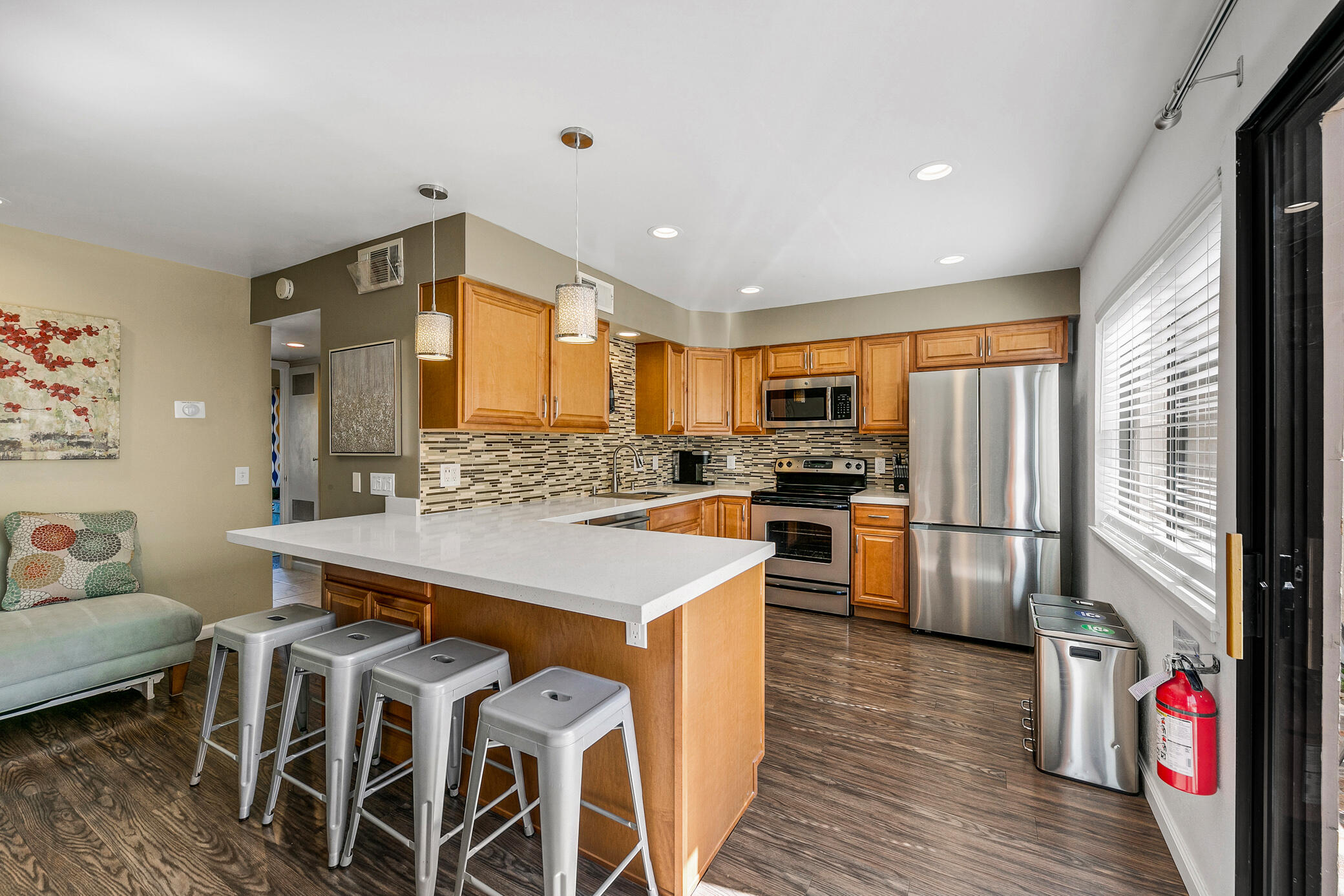 6025 Arroyo Road, Unit 7 Palm Springs, CA 92264 - Photo 15 of 43 a kitchen with stainless steel appliances a stove a sink refrigerator and a refrigerator