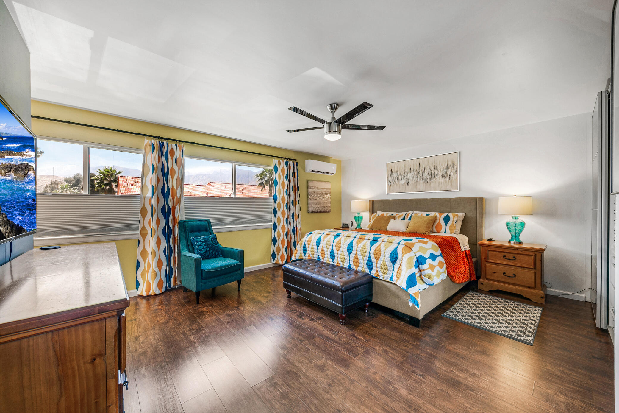 6025 Arroyo Road, Unit 7 Palm Springs, CA 92264 - Photo 21 of 43 a bedroom with a bed and a chandelier
