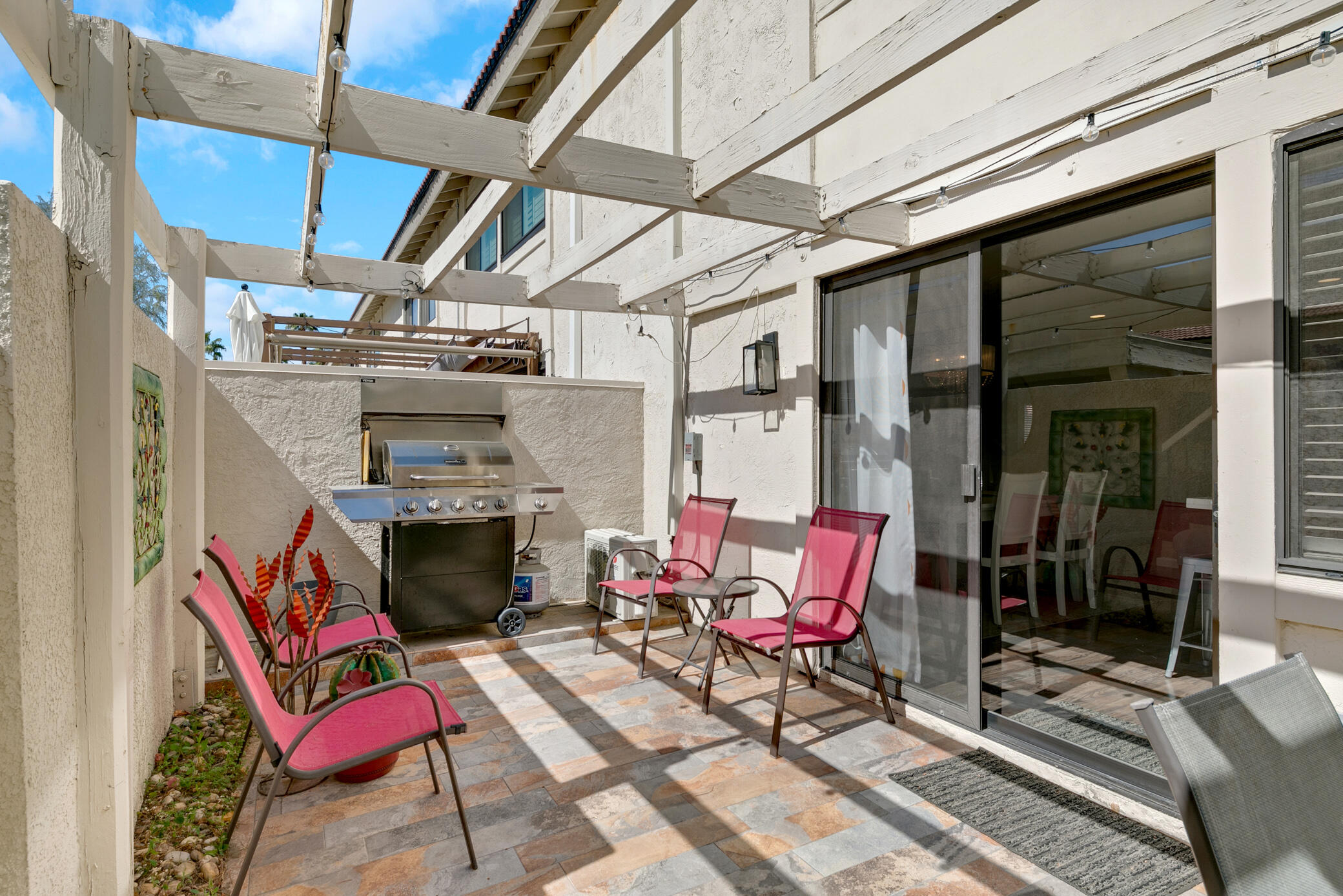 6025 Arroyo Road, Unit 7 Palm Springs, CA 92264 - Photo 30 of 43 a patio with table and chairs