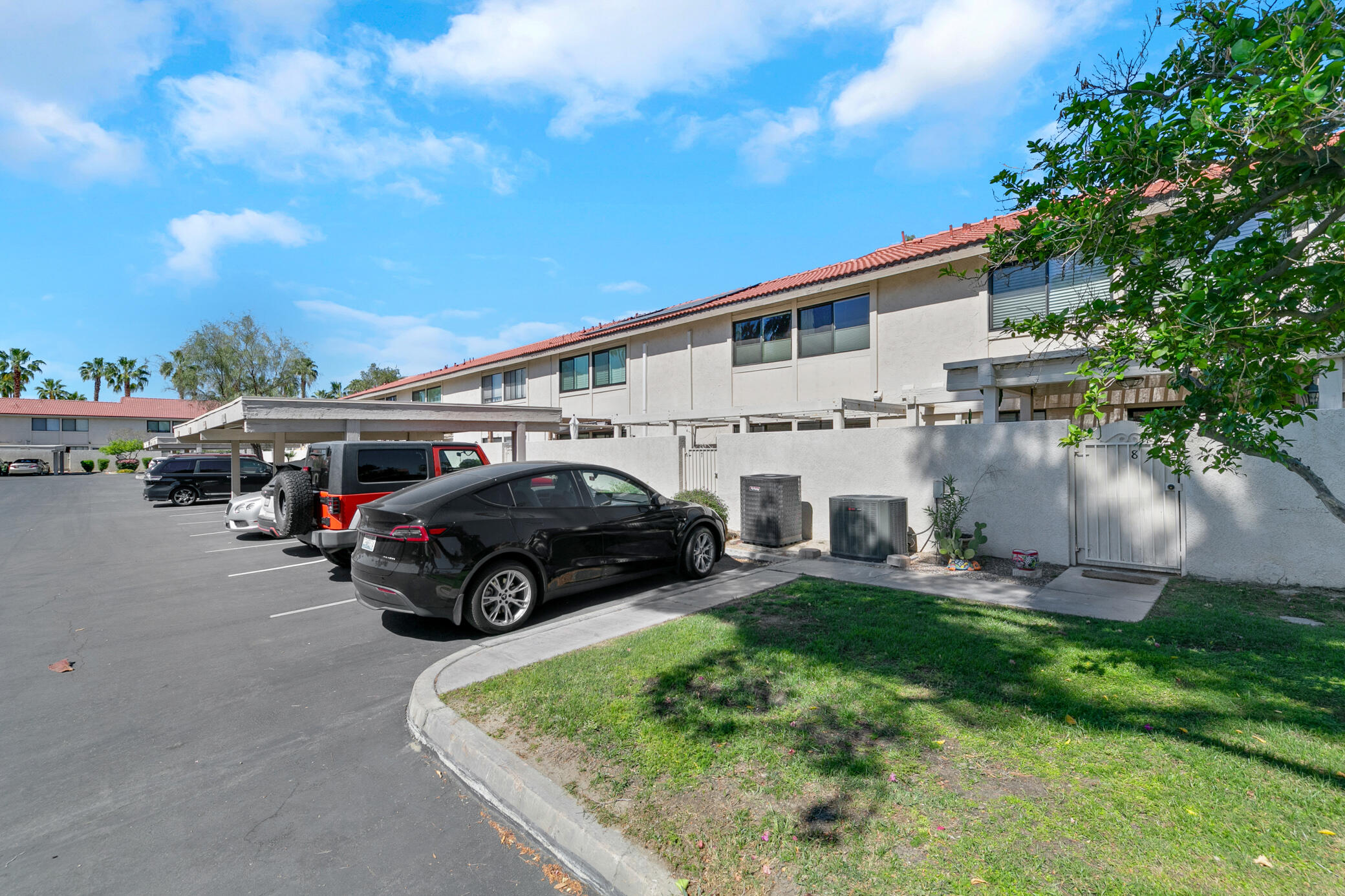 6025 Arroyo Road, Unit 7 Palm Springs, CA 92264 - Photo 33 of 43 a view of house with outdoor space and car parked