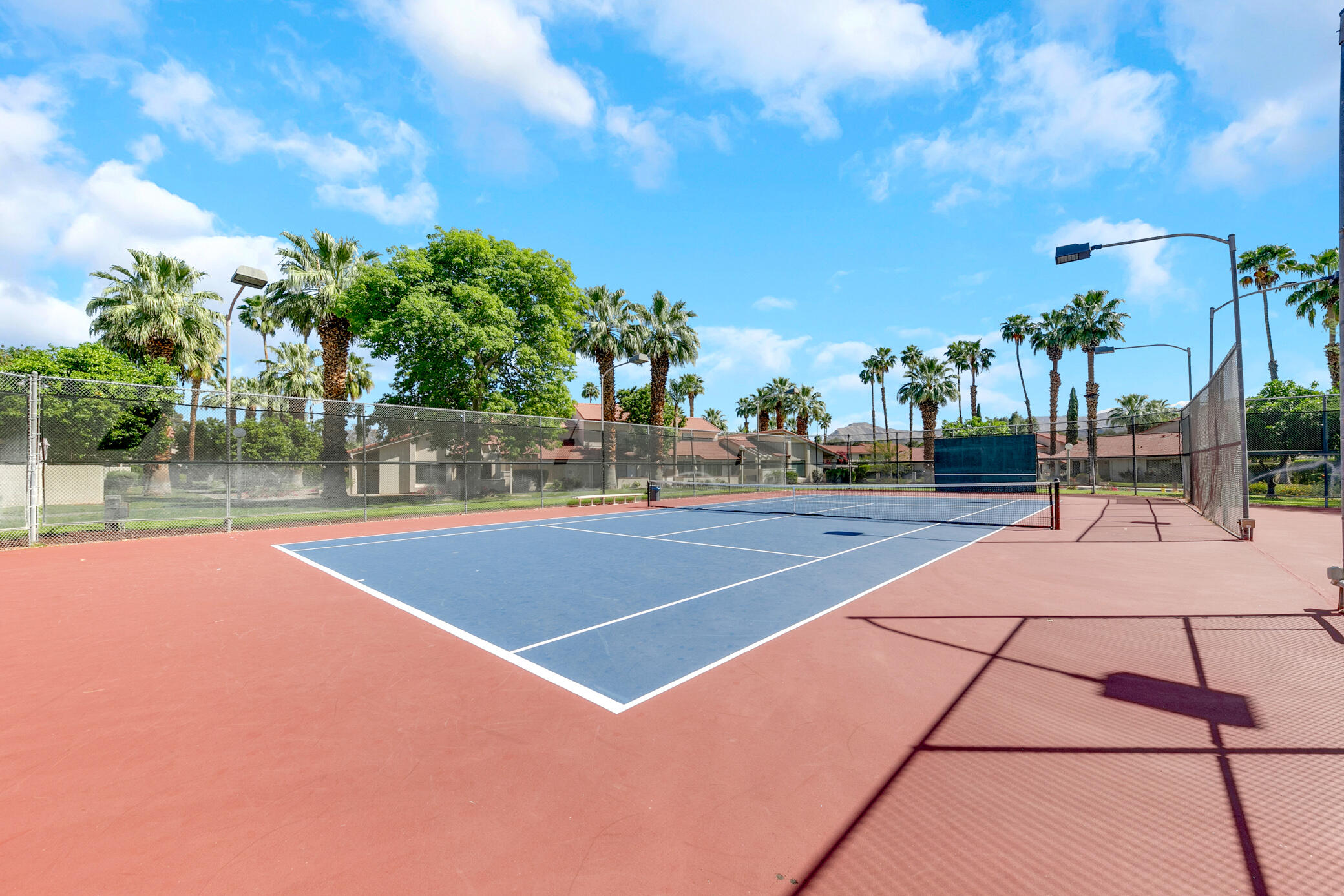 6025 Arroyo Road, Unit 7 Palm Springs, CA 92264 - Photo 35 of 43 a view of a tennis court