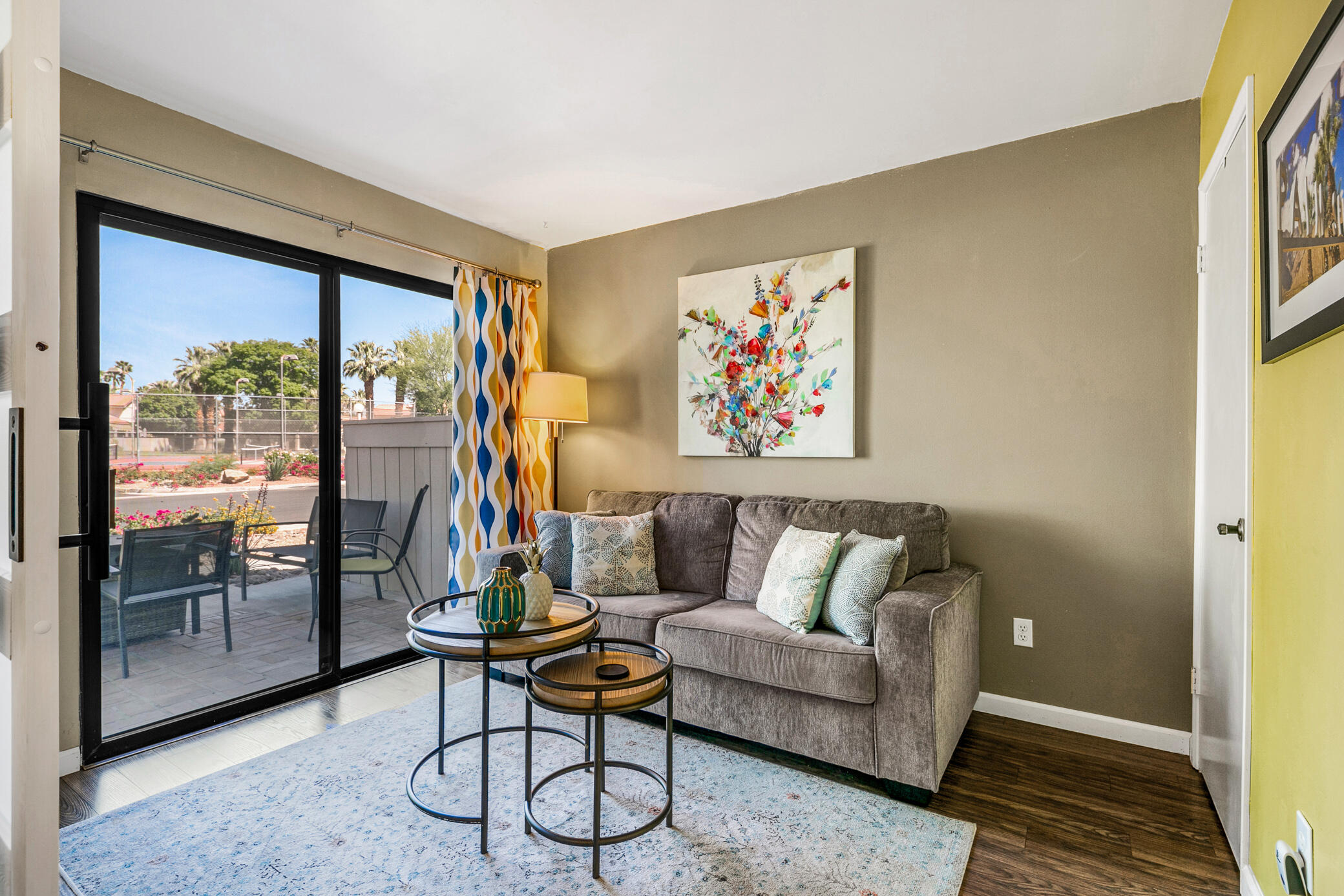 6025 Arroyo Road, Unit 7 Palm Springs, CA 92264 - Photo 7 of 43 a living room with furniture and a floor to ceiling window