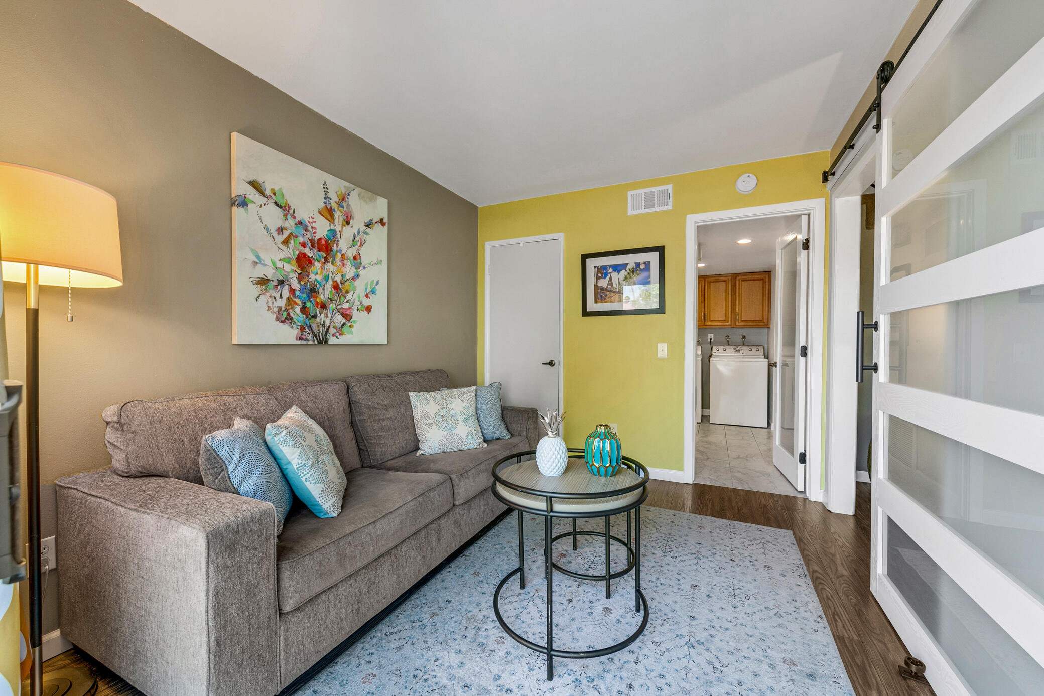 6025 Arroyo Road, Unit 7 Palm Springs, CA 92264 - Photo 8 of 43 a living room with furniture and a painting on the wall