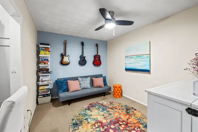 a bedroom with a bed and a dresser in it