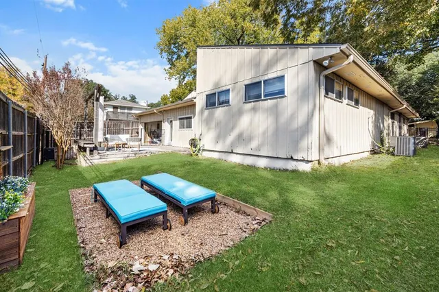 a view of a backyard with a garden and plants