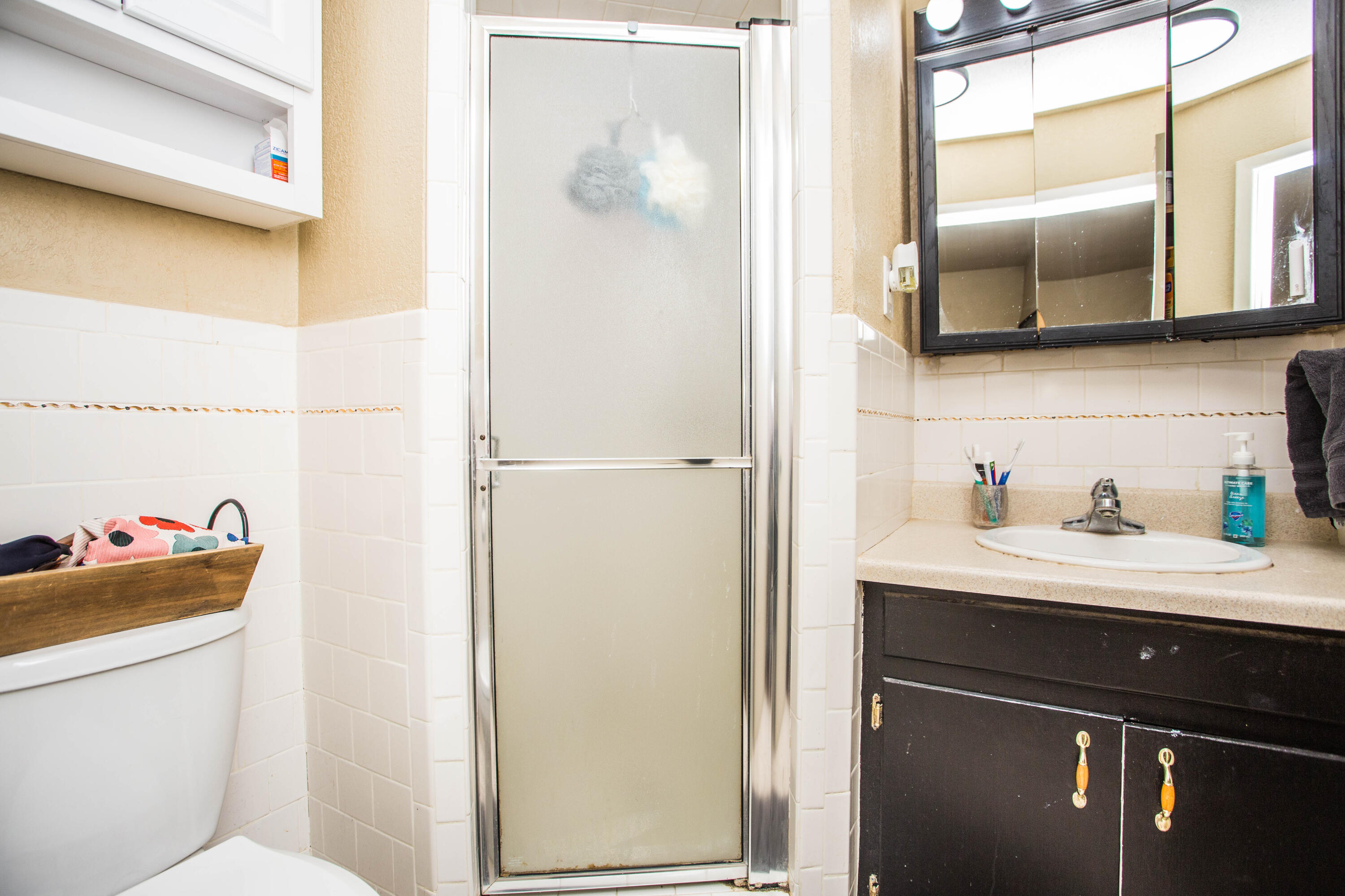 1550 West Lynn Street Slaton, TX 79364 - Photo 25 of 54 a bathroom with a sink vanity and a toilet