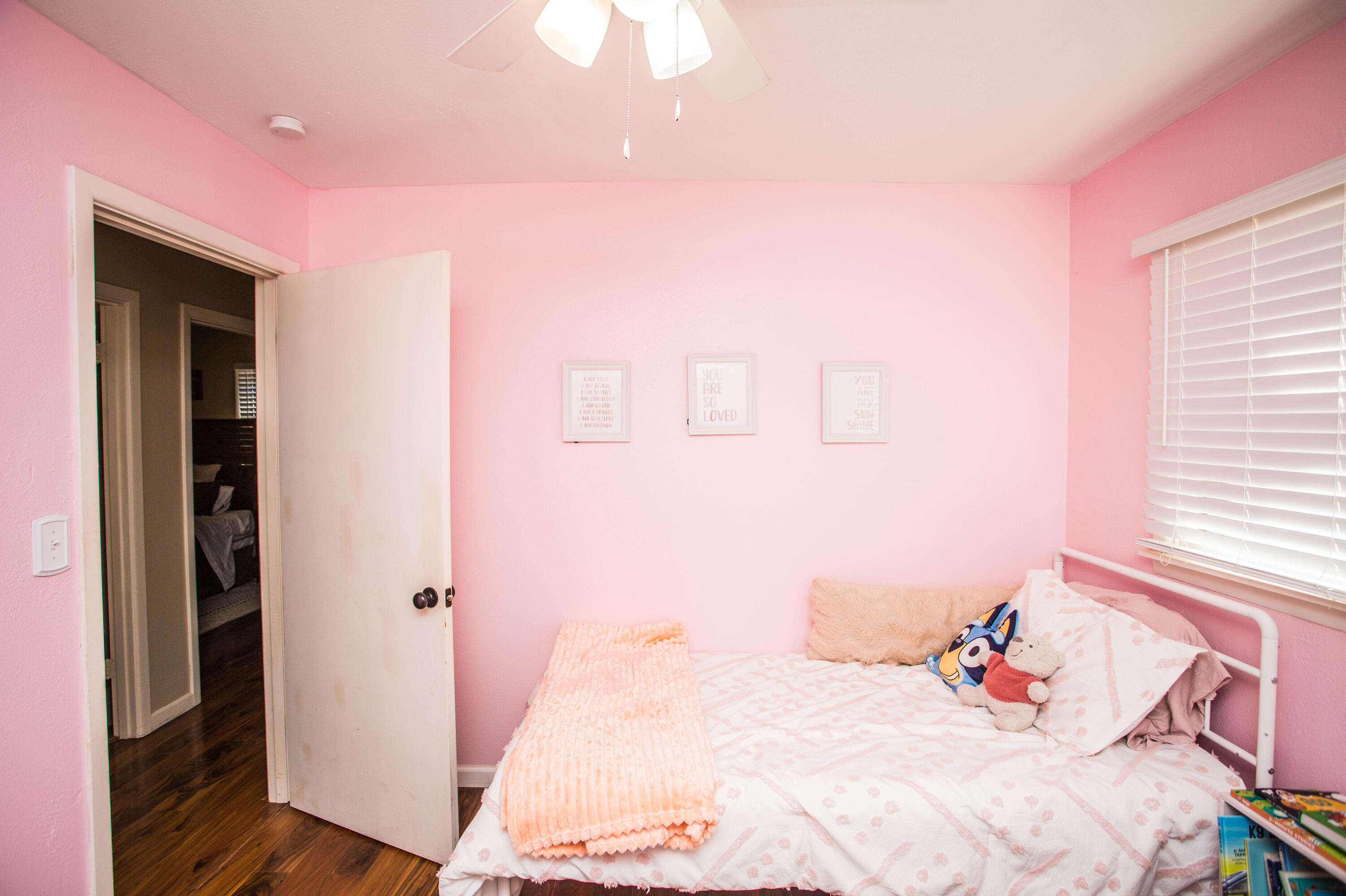1550 West Lynn Street Slaton, TX 79364 - Photo 28 of 54 a bedroom with a bed and a window