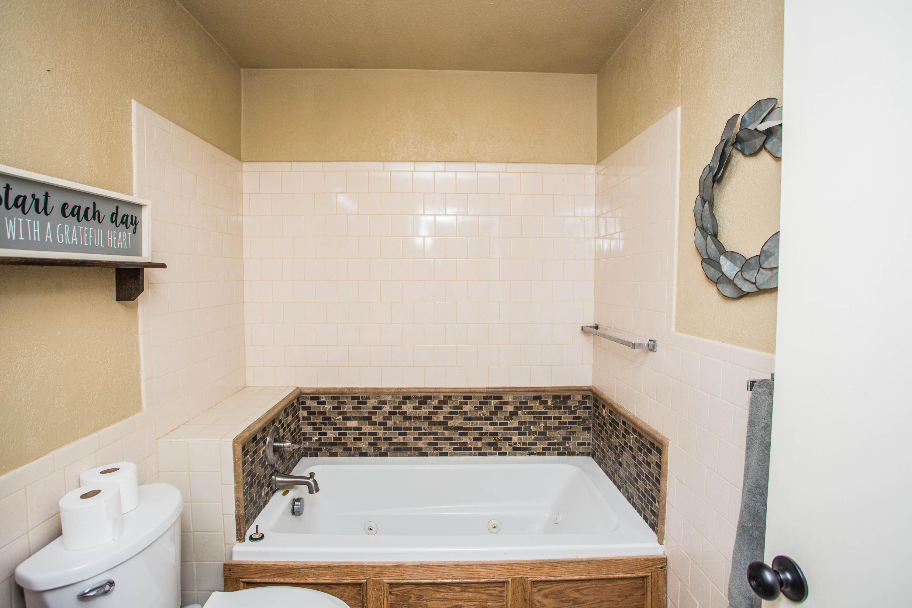 1550 West Lynn Street Slaton, TX 79364 - Photo 30 of 54 a bathroom with a sink and a mirror