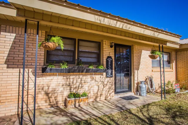 a front view of a house with large windows