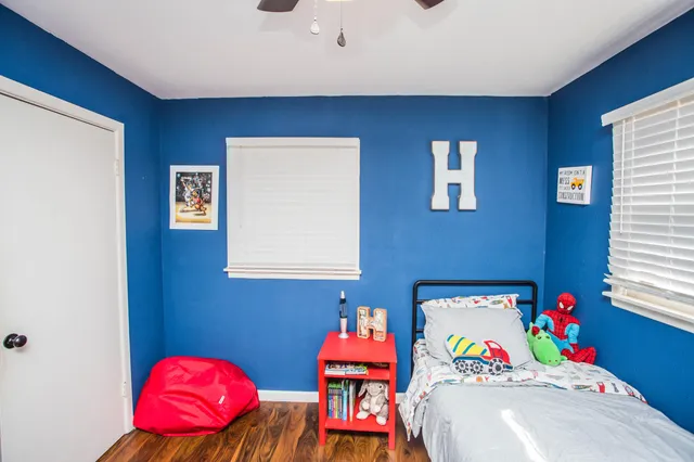 a view of a dining room with furniture wooden floor and a chandelier