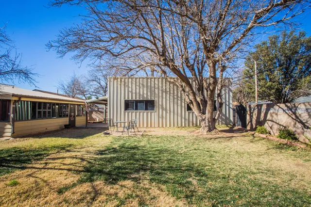 a view of a house with a street