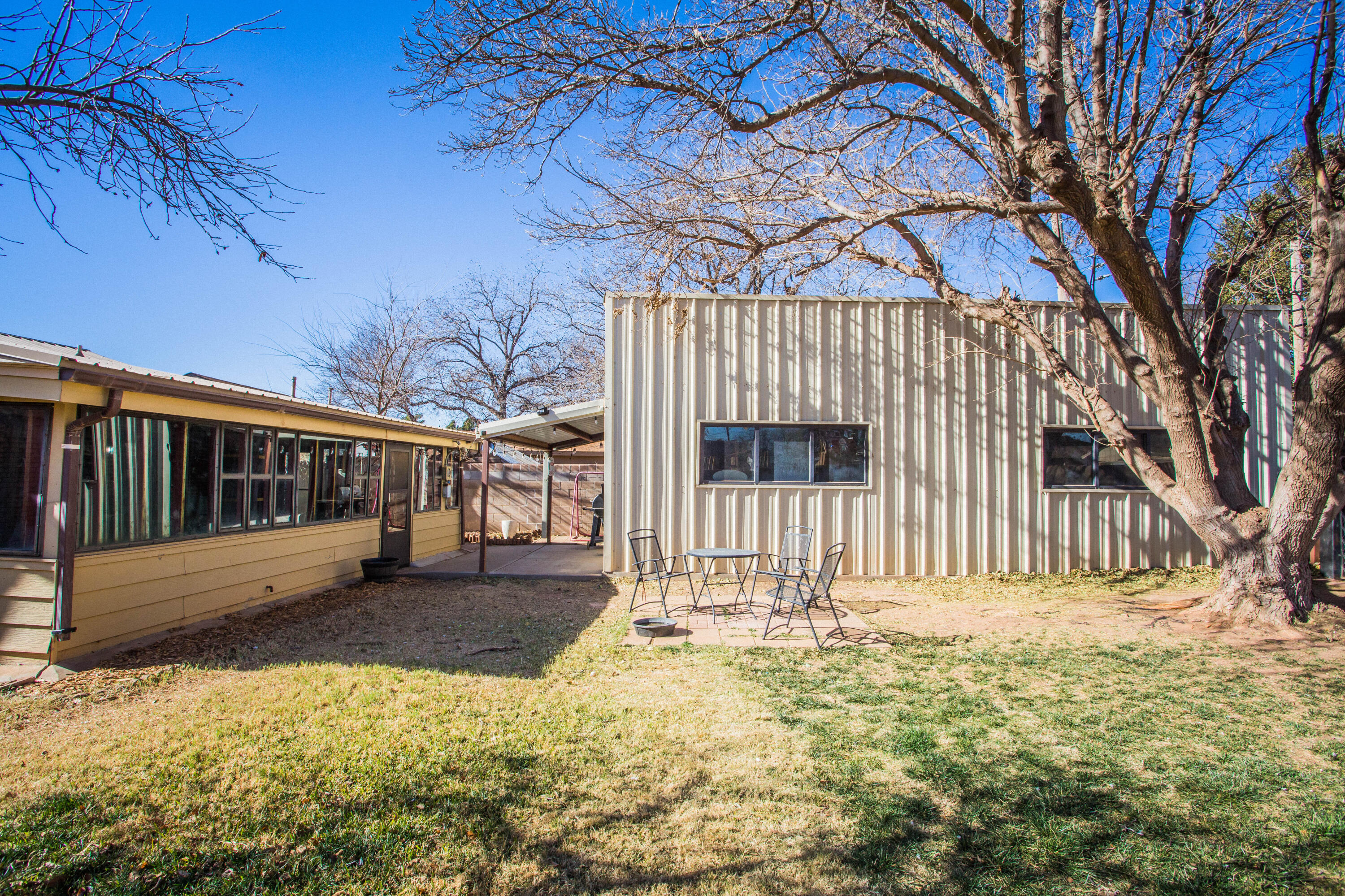 1550 West Lynn Street Slaton, TX 79364 - Photo 41 of 54 a view of a house with a wooden fence