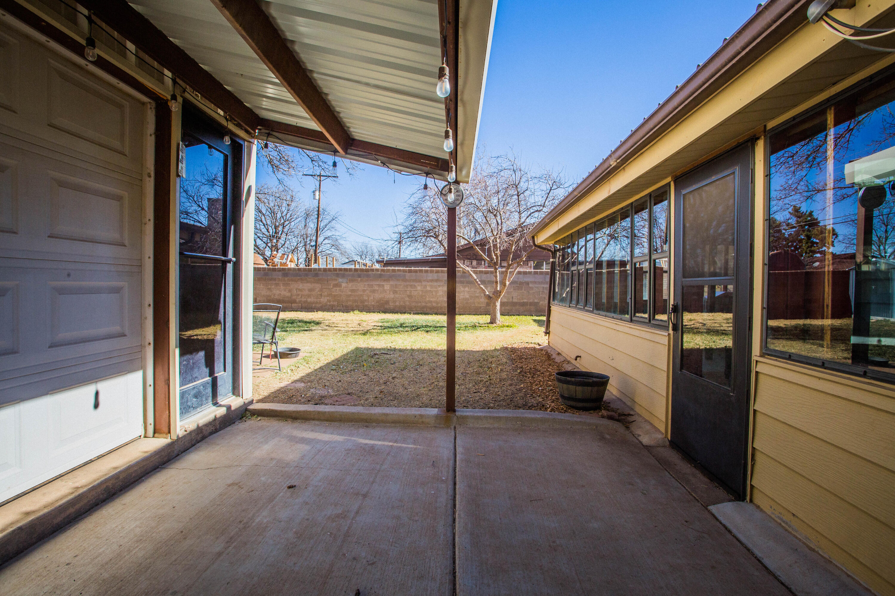 1550 West Lynn Street Slaton, TX 79364 - Photo 45 of 54 a view of a porch with a door