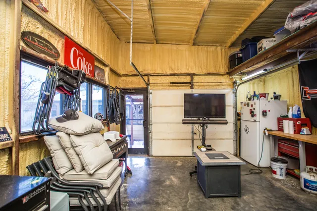 a view of a house with a yard covered in snow