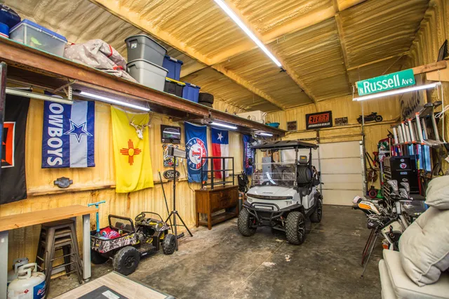 a front view of a house with a yard covered in snow