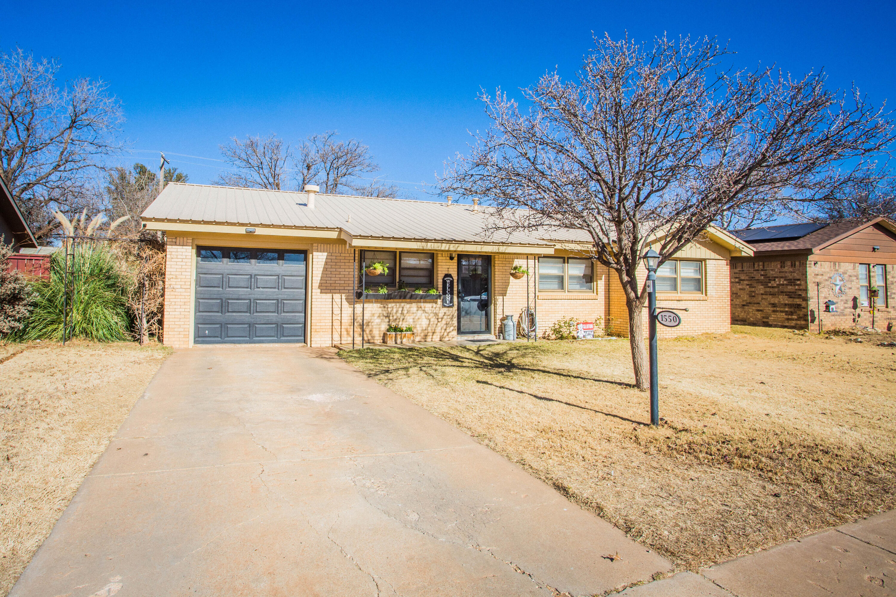 1550 West Lynn Street Slaton, TX 79364 - Photo 54 of 54 a view of a house with a outdoor space