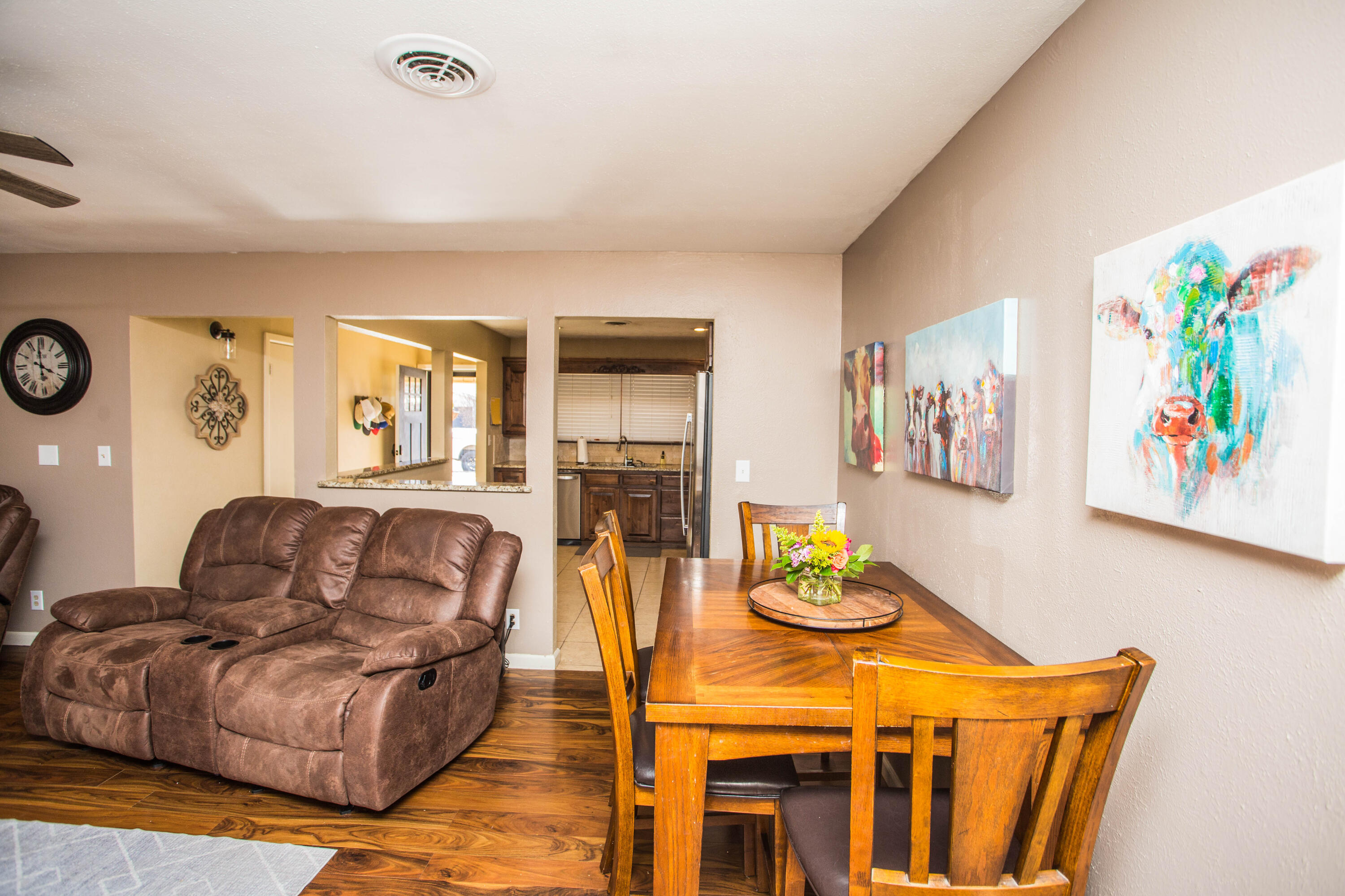 1550 West Lynn Street Slaton, TX 79364 - Photo 10 of 54 a living room with furniture and painting on the wall