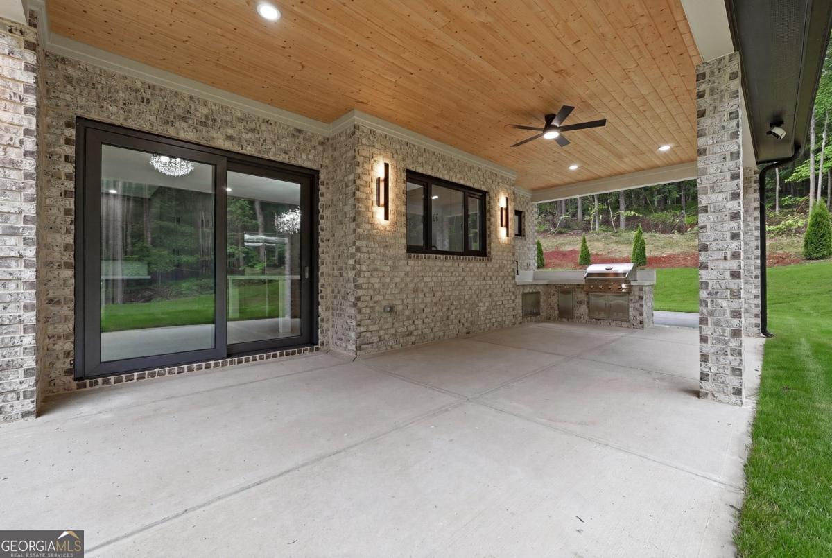 1563 Whitley Road Bethlehem, GA 30620 - Photo 38 of 44 a view of a patio with a tv