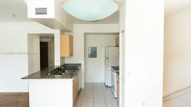 a room with a sink and a mirror