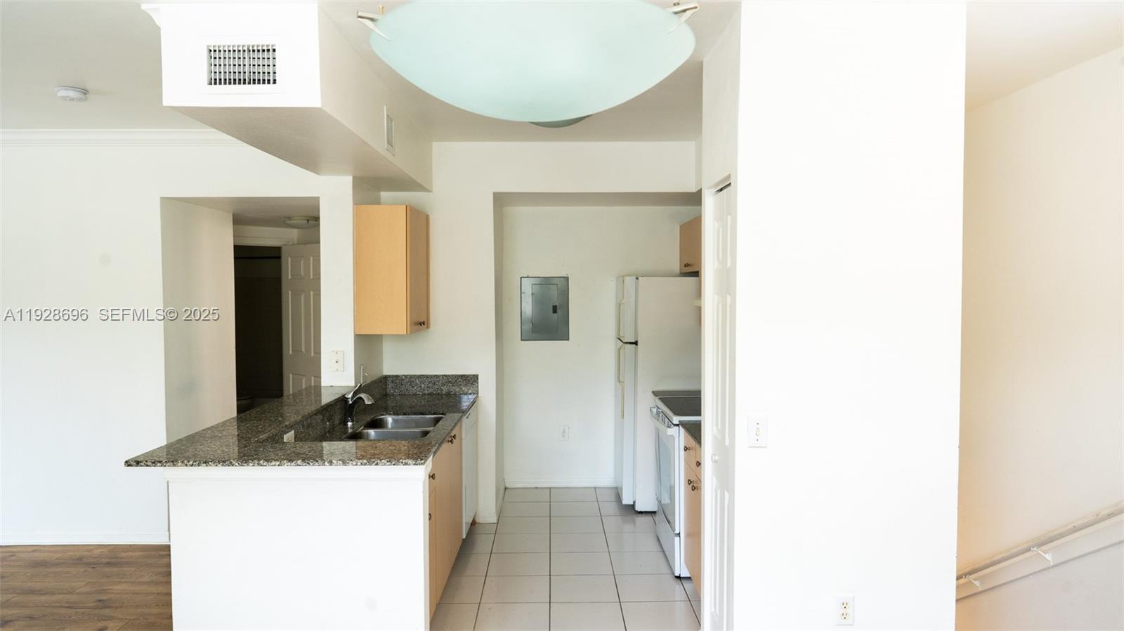 2406 Centergate Drive, Unit 201 Miramar, FL 33025 - Photo 12 of 41 a room with a sink and a mirror